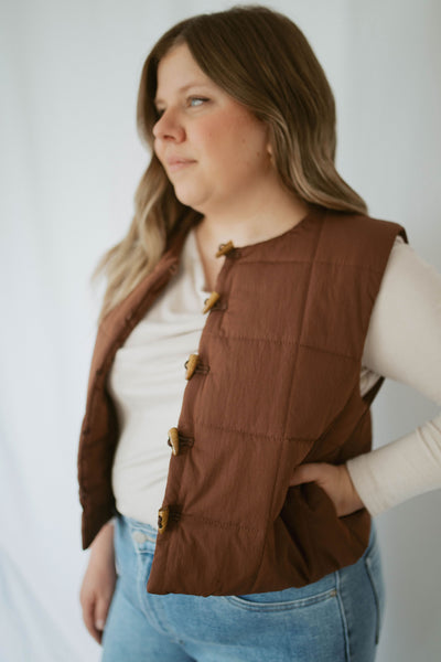quilted cropped vest with wooden buttons
