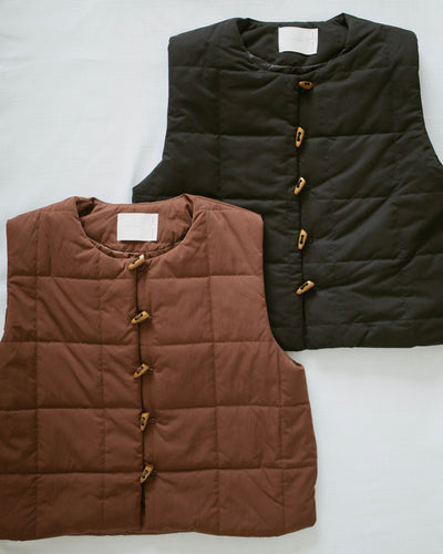 quilted cropped vest with wooden buttons