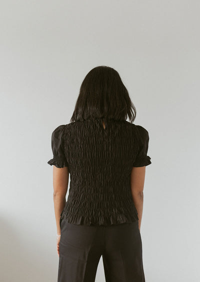 short sleeve smocked blouse